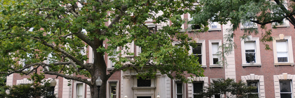 Mathematics building with tree and students.
