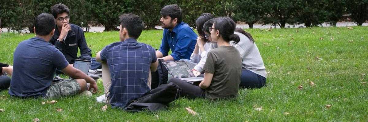 MPA-ESP Student sitting on a lawn