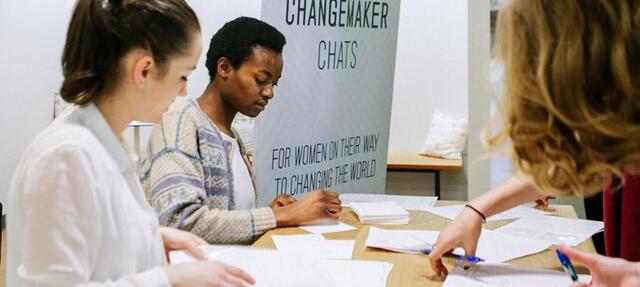 Employees working at table