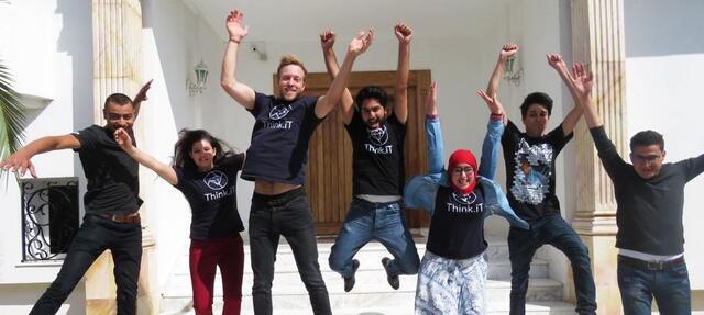 Workers celebrating with a jump