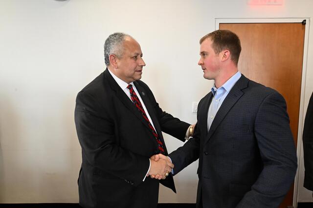 Secretary of the Navy Carlos Del Toro speaks with SIPA student David Sweeterman.