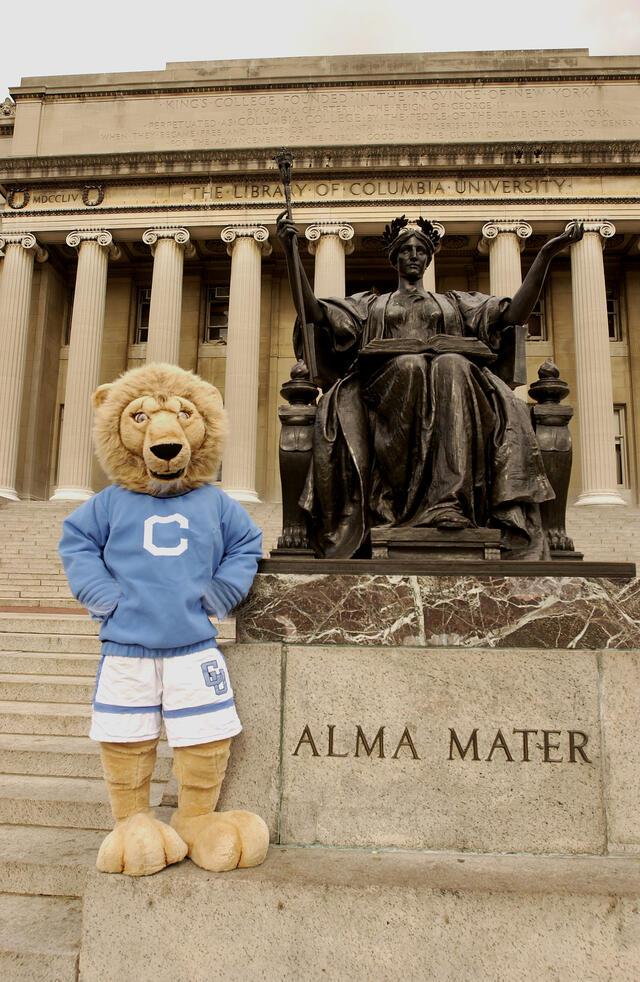 Roaree the Columbia Lion Mascot standing next to alma mater statue.